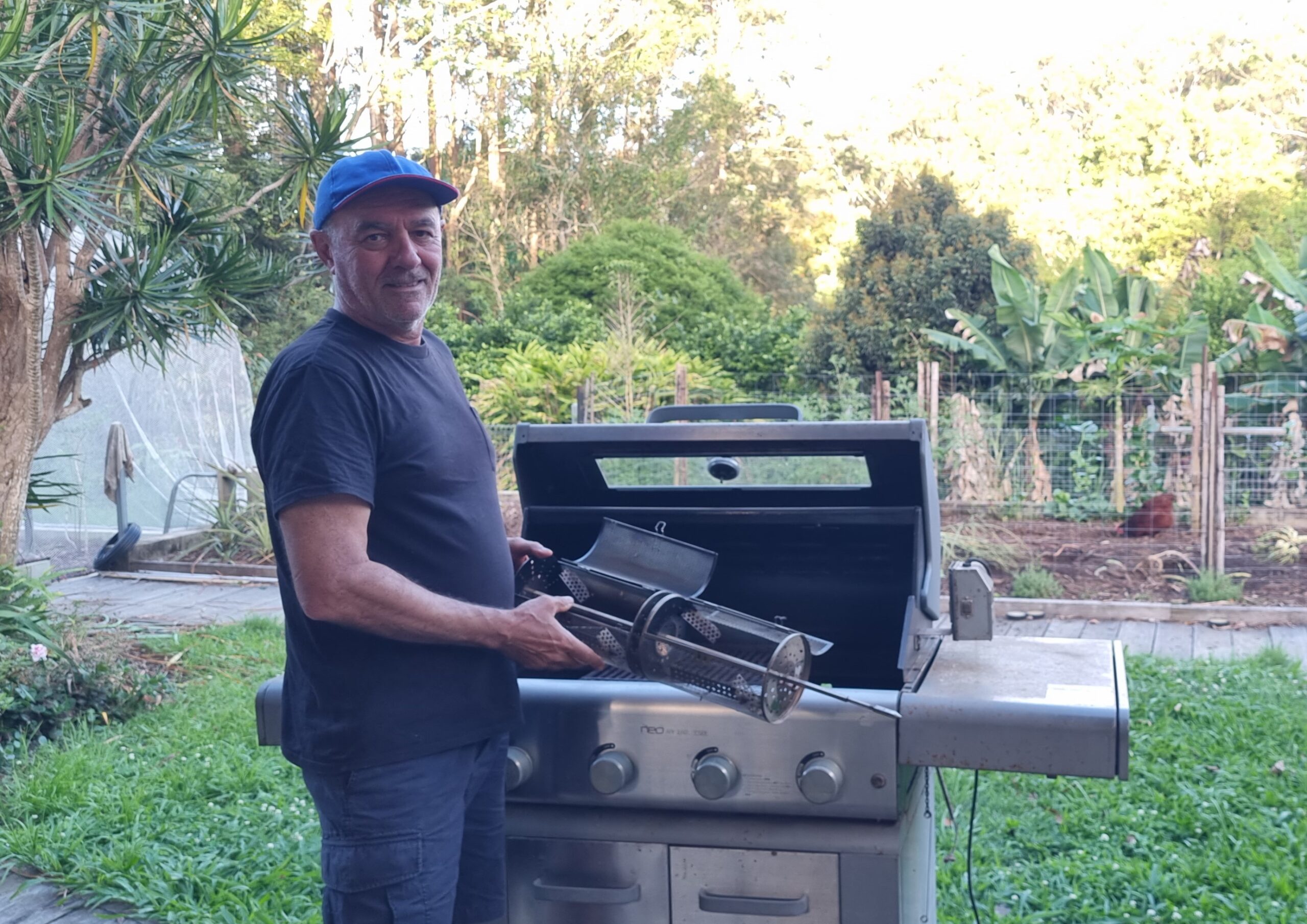 Me showing my coffee roaster BBQ with roasting drums.